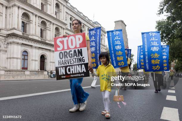 Falun Gong protestor holding a placard that says 'stop organ harvesting in China', during the demonstration. Falun Gong is a global organisation that...