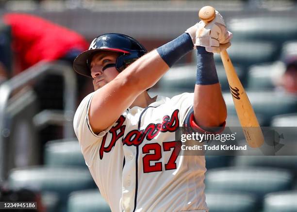 Austin Riley of the Atlanta Braves watches after hitting a two-run home run in the fourth inning of an MLB game against the San Francisco Giants at...