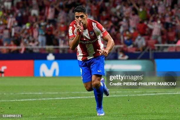 Atletico Madrid's Uruguayan forward Luis Suarez celebrates his goal during the Spanish League football match between Club Atletico de Madrid and...