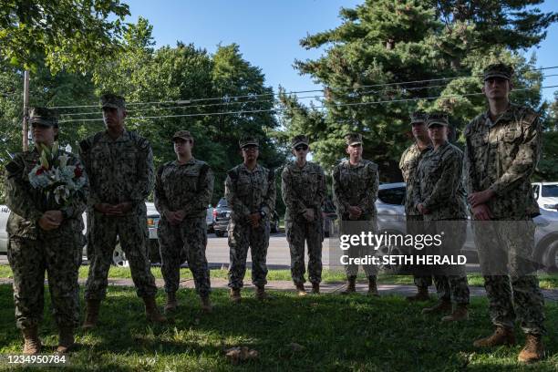 Navy service members attend a vigil for Navy Corpsman Maxton "Max" W. Soviak at Edison Middle School in Berlin Heights, Ohio on August 29, 2021. -...