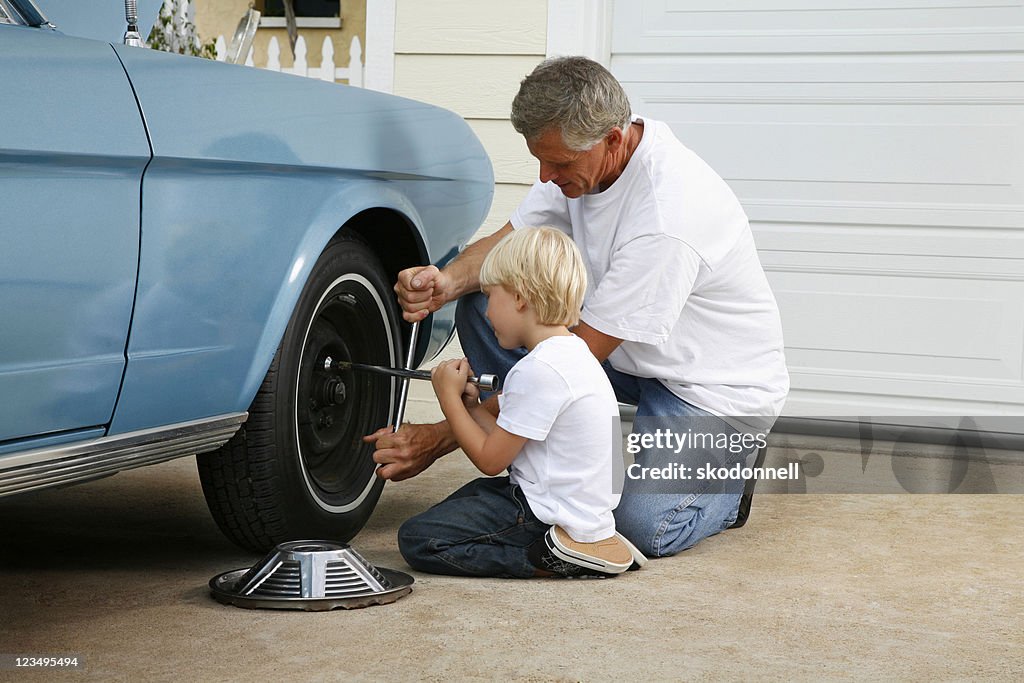 Father and son working on the car