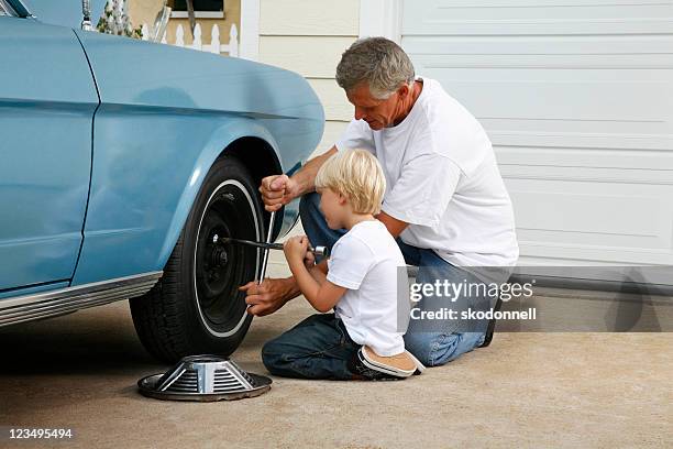 father and son working on the car - classic car stock pictures, royalty-free photos & images