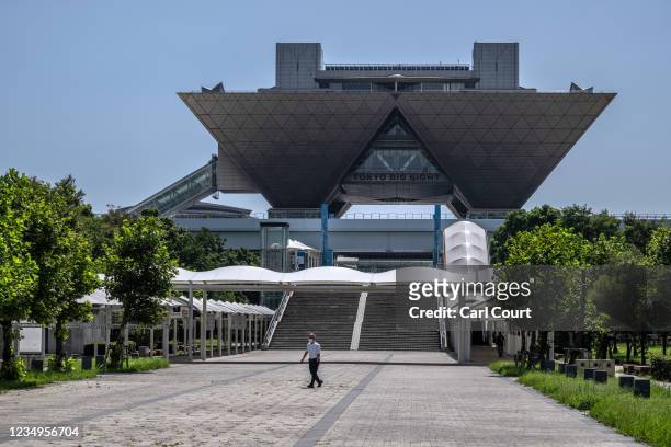 Man walks past Tokyo Big Sight, the location of the Main Press Centre for the Tokyo Olympic and Paralympic Games, on August 30, 2021 in Tokyo, Japan....
