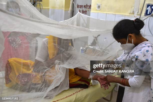 Patient receives treatment in the dengue ward of a government hospital in Allahabad on August 30, 2021.