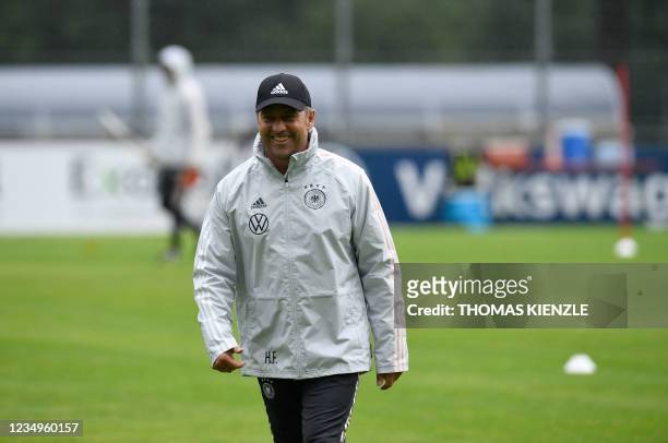 Hansi Flick, new headcoach of Germany's national football team, walks over the pitch during a training session on August 30, 2021 in Stuttgart,...