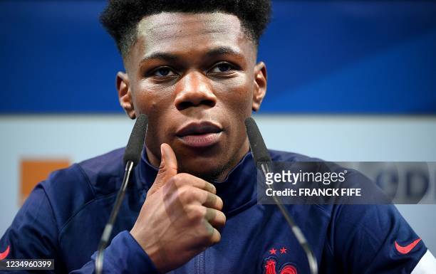 France's national football team midfielder Aurelien Tchouameni gives a press conference in Clairefontaine-en-Yvelines on August 30, 2021 as part of...
