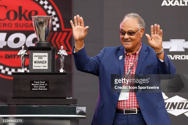 Frank Scott, son of Wendell Scott, stands next to the trophy from the 1963 Jacksonville 200, presented to the family of Wendell Scott, the only Black...