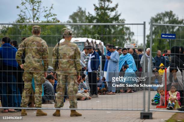 Recently-arrived refugees from Afghanistan seen at a temporary camp at the U.S. Army's Rhine Ordnance Barracks , where they are being temporarily...