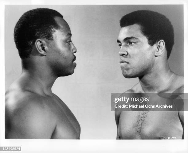 Roger E Mosley and Muhammad Ali stand face to face in a scene from the film 'The Greatest', 1977.