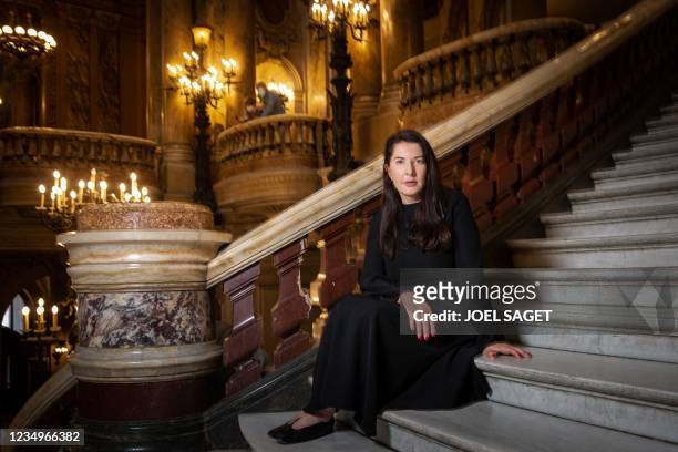 Serbian conceptual and performance artist, philanthropist, writer, and filmmaker Marina Abramovic poses at the Opera Garnier during a photo session...
