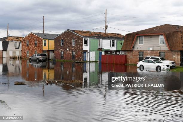 Homes stand partially flooded in LaPlace, Louisiana on August 30, 2021 in the aftermath of Hurricane Ida. - Rescuers on Monday combed through the...