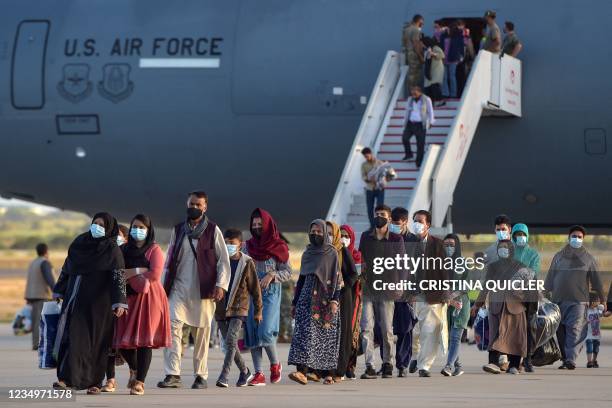 Refugees disembark from a US air force aircraft after an evacuation flight from Kabul at the Rota naval base in Rota, southern Spain, on August 31,...