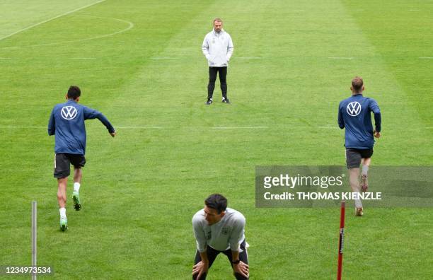 Hansi Flick , new headcoach of the Germany's national football team, watches his players during a training session in Stuttgart, southern Germany, on...