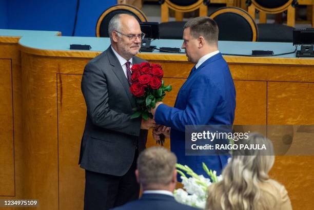 Juri Ratas , Speaker of Estonia's parliament Riigikogu, congratulates Estonia's new President Alar Karis after he was elected in a second round of...