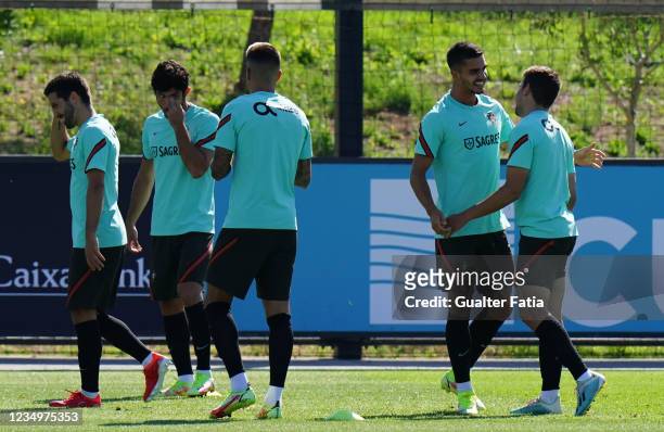 Andre Silva of RB Leipzig and Portugal with Raphael Guerreiro of Borussia Dortmund during the Portugal National Team Training Session at Cidade do...