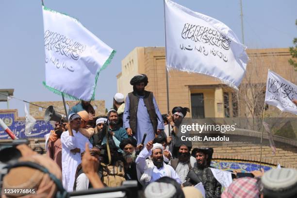 Taliban members gather and make speeches in front of Herat governorate after the completion of the U.S. Withdrawal from Afghanistan, in Herat,...