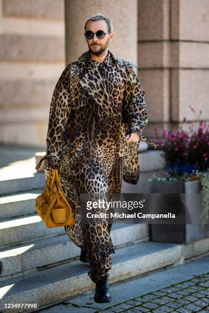 Fredrik Robertsson wearing Anna-Karin Karlsson, Dolce Gabbana, and Hermès poses for a picture outside of the Stockholm Opera House on the first day...