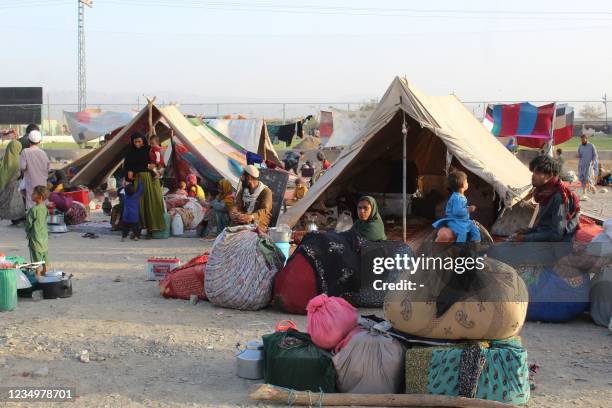 Afghan refugees rest in tents at a makeshift shelter camp in Chaman, a Pakistani town at the border with Afghanistan, on August 31, 2021 after the US...