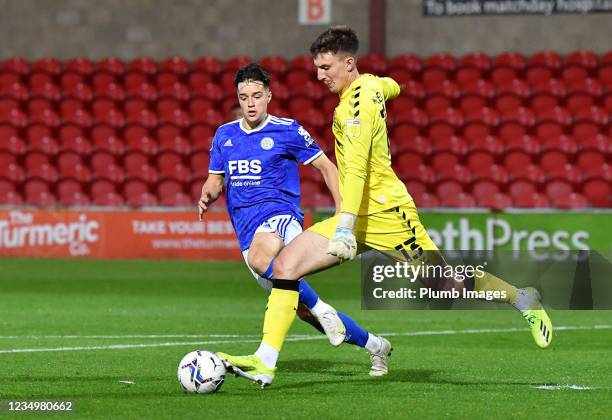 Jake Wakeling of Leicester City in action with Billy Crellin of Fleetwood Town during the Papa John's Trophy match between Fleetwood Town and...