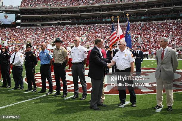 Alabama Governor Robert Bentley thanks the Tuscaloosa County first responders for their help during the April 27th tornadoes before the game with the...