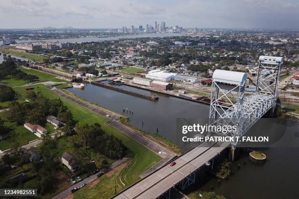 An aerial image shows the New Orleans Skyline and the Industrial Canal along Jourdan Avenue with the Claiborne Avenue Bridge in the Lower Ninth Ward...