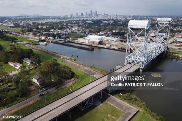 An aerial image shows the New Orleans Skyline and the Industrial Canal along Jourdan Avenue with the Claiborne Avenue Bridge in the Lower Ninth Ward...