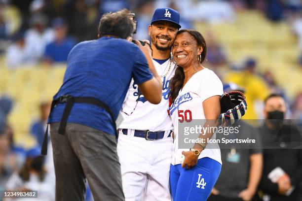 Los Angeles Dodgers right fielder Mookie Betts poses for a picture with his mom before the MLB game between the Atlanta Braves and the Los Angeles...