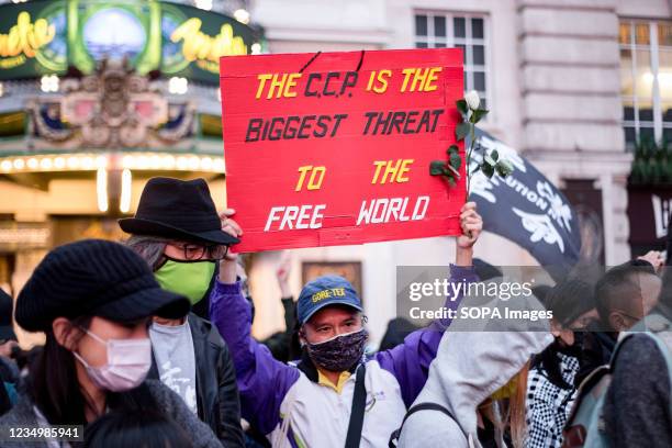 Hong Konger holds a placard that says The CCP is the biggest threat to the free world during the rally. The Hong Kong diaspora gathered at Piccadilly...