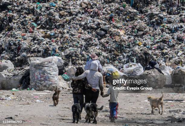 People during the collection and separation of waste that arrives daily at the largest garbage dump in Mexico Bordo de Xochiaca, which has become a...