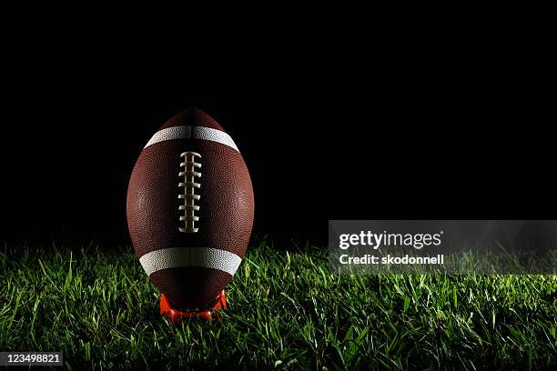 american football on a tee - aftrappen stockfoto's en -beelden
