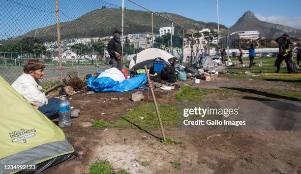 Law enforcement officers remove tents around Sea Point Tennis Courts on August 23, 2021 in Cape Town, South Africa. It is reported that displaced...