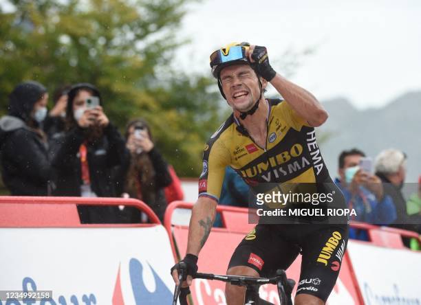 Team Jumbo's Slovenian rider Primoz Roglic celebrates as he wins the 17th stage of the 2021 La Vuelta cycling tour of Spain, a 185.8 km race from...