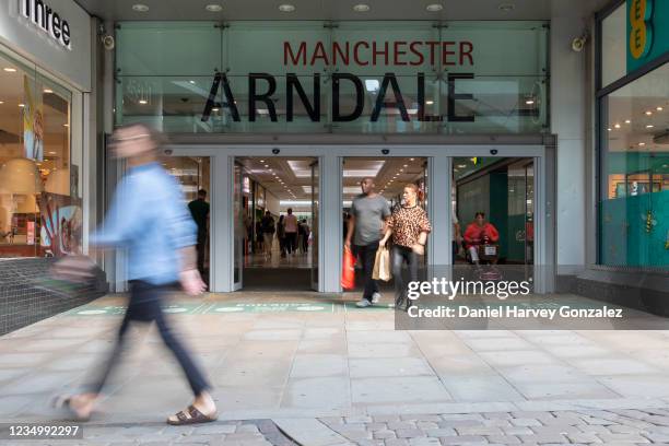 People, some with bags of shopping, coming and going from Manchester city centre's Arndale shopping centre on 26th August, 2021 in Manchester, United...