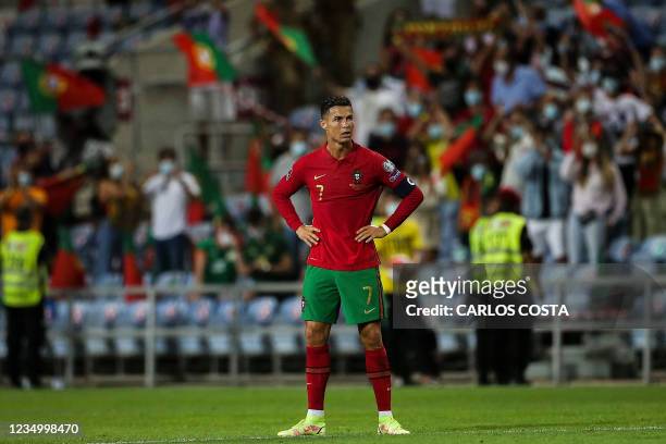 Portugal's forward Cristiano Ronaldo reacts after the FIFA World Cup Qatar 2022 European qualifying round group A football match between Portugal and...