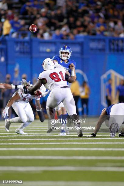 San Jose State Spartans QB Nick Starkel throws as Southern Utah Thunderbirds DL Francis Bemiy closes in during the game between the Southern Utah...