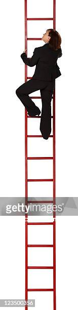 business woman climbing the ladder of success - ladder stock pictures, royalty-free photos & images