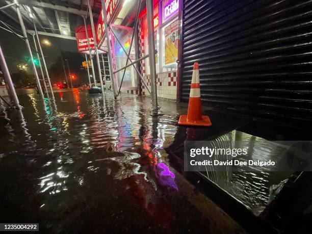 Rainfall from Hurricane Ida flood the basement of a Kennedy Fried Chicken fast food restaurant on September 1 in the Bronx borough of New York City....