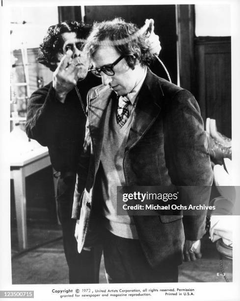 Ref Sanches is placing a cord around Woody Allen's head in a scene from the film 'Every Thing You Always Wanted To Know About Sex', 1972.