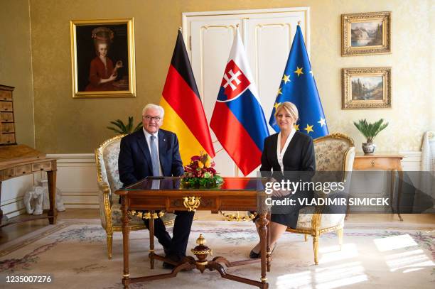 The President of Slovakia Zuzana Caputova and German President Frank-Walter Steinmeier pose for a photo during a welcome ceremony at the Presidential...