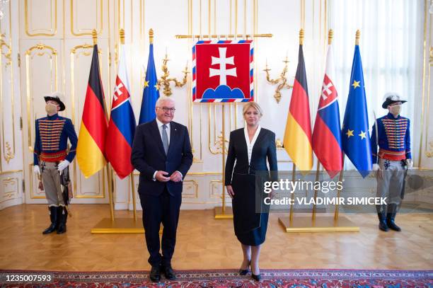The President of Slovakia Zuzana Caputova and German President Frank-Walter Steinmeier pose for a photo during a welcome ceremony at the Presidential...