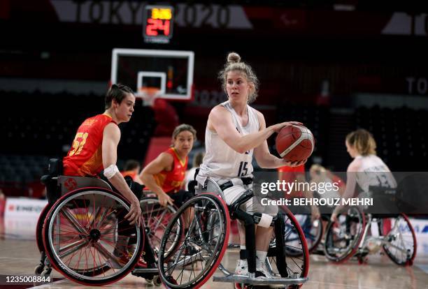 Britain's Robyn Love holds the ball in the wheelchair basketball women's classification playoff 7/8 match between Britain and Spain during the Tokyo...