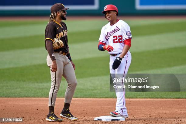Juan Soto of the Washington Nationals jokes with Fernando Tatis Jr. #23 of the San Diego Padres in the third inning at Nationals Park on July 18,...
