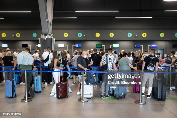Passengers queue to check in inside Thessaloniki Makedonia Airport , operated by Fraport Greece, in Thessaloniki, Greece, on Thursday, Sept. 2, 2021....