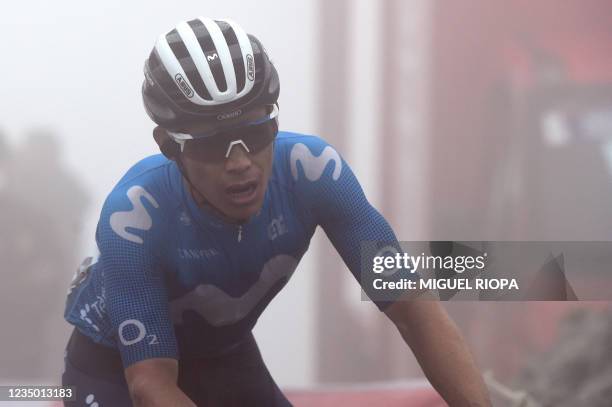 Team Movistar's Colombian rider Miguel Angel Lopez crosses the finish line in first place during the 18th stage of the 2021 La Vuelta cycling tour of...