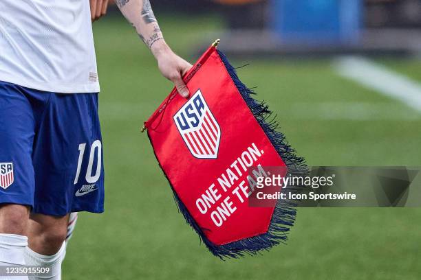 United States forward Christian Pulisic is seen holding the United States Soccer Federation Crest in action during the CONCACAF Nations League finals...