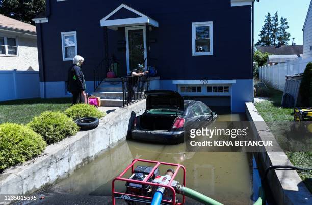 Car sits on a flooded garage of a house following a night of heavy wind and rain from the remnants of Hurricane Ida on September 02, 2021 in...