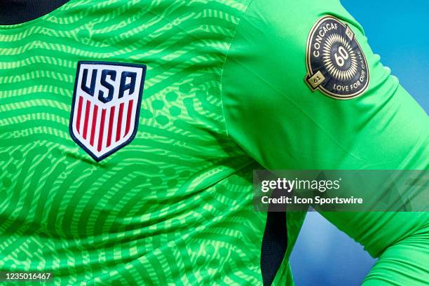 Detail view of the United States Soccer Federation Crest and the CONCACAF 60th Anniversary logo is seen on the jersey of United States goalkeeper...