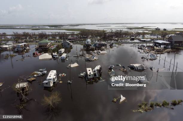 Damaged homes in floodwater after Hurricane Ida in Pointe-Aux-Chenes, Louisiana, U.S., on Thursday, Sept. 2, 2021. The electric utility that serves...