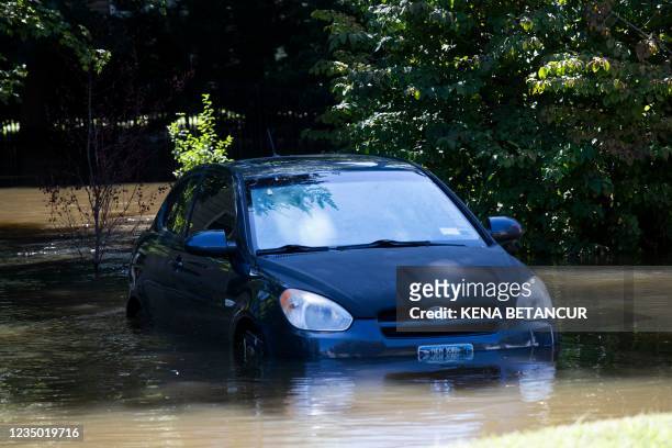Car sits in a flooded parking spot after a night of high winds and rain from the remnants of Hurricane Ida on September 2, 2021 in Mamaroneck, New...