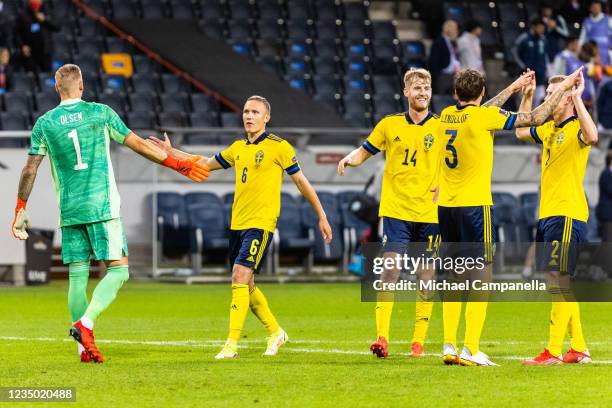 Swedish players embrace during the 2022 FIFA World Cup Qualifier match between Sweden and Spain at Friends Arena on September 2, 2021 in Stockholm,...
